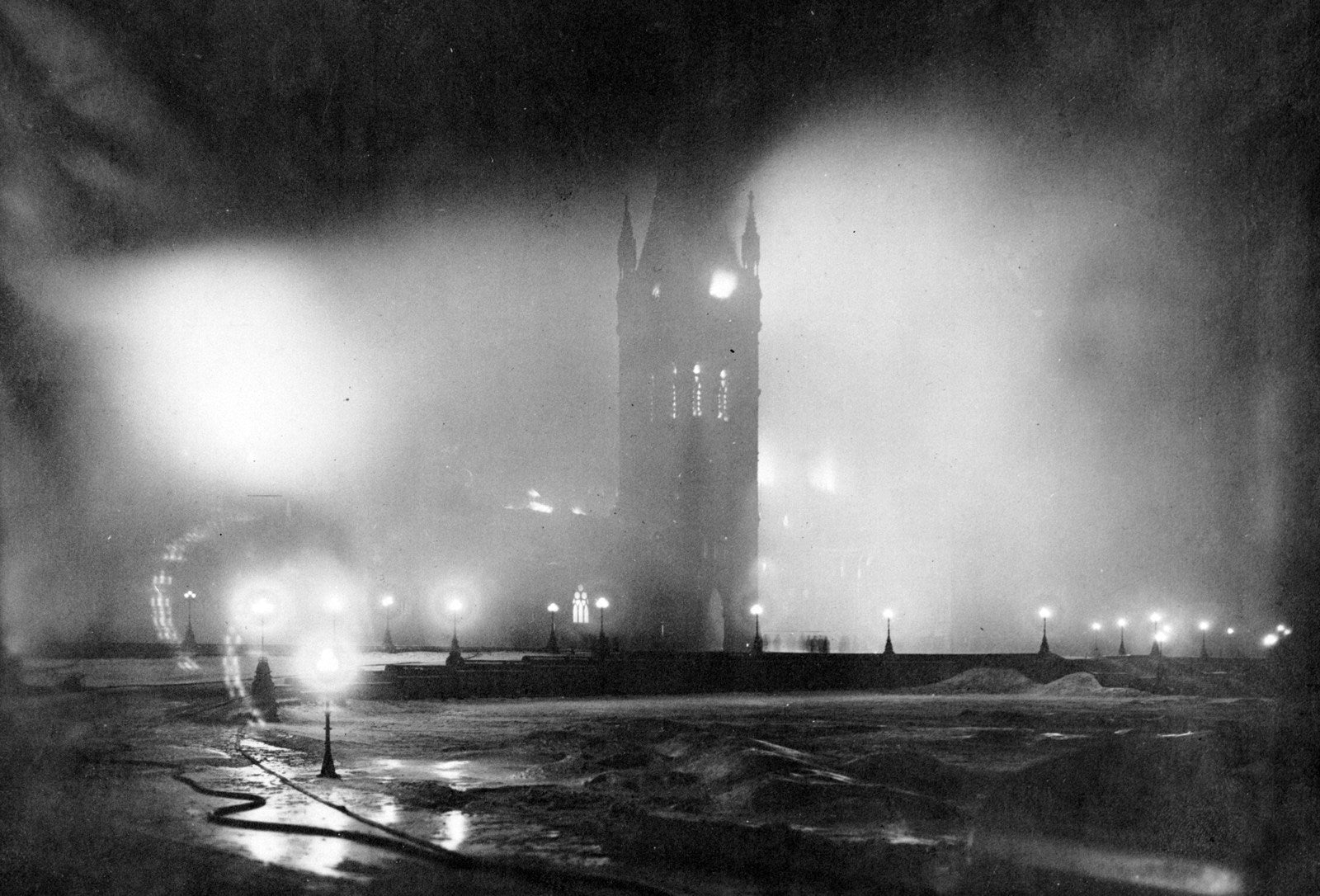 Flames engulf the original Centre Block, with Victoria Tower still standing, February 4, 1916